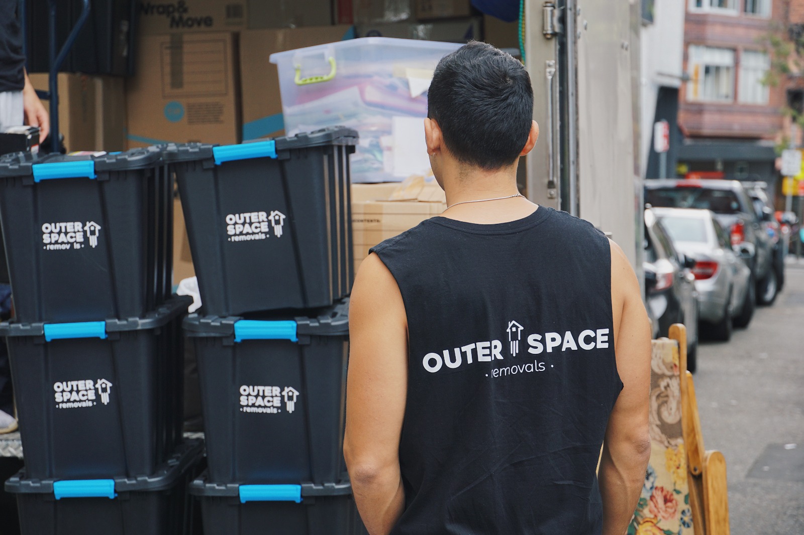 Outer Space Removals crew with stacked 55L moving crates at our Bondi Junction storage