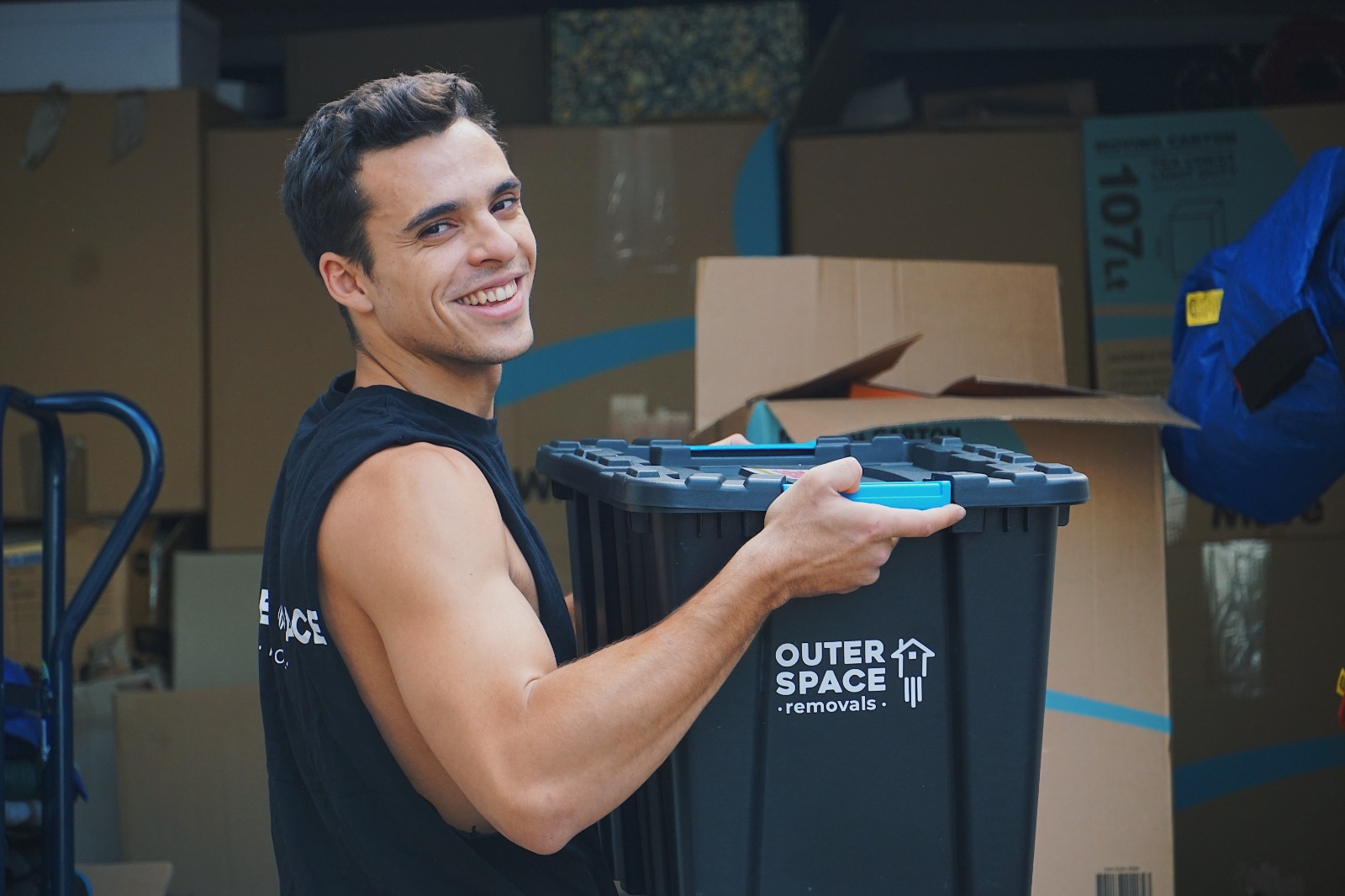 Smiling Outer Space mover with a crate